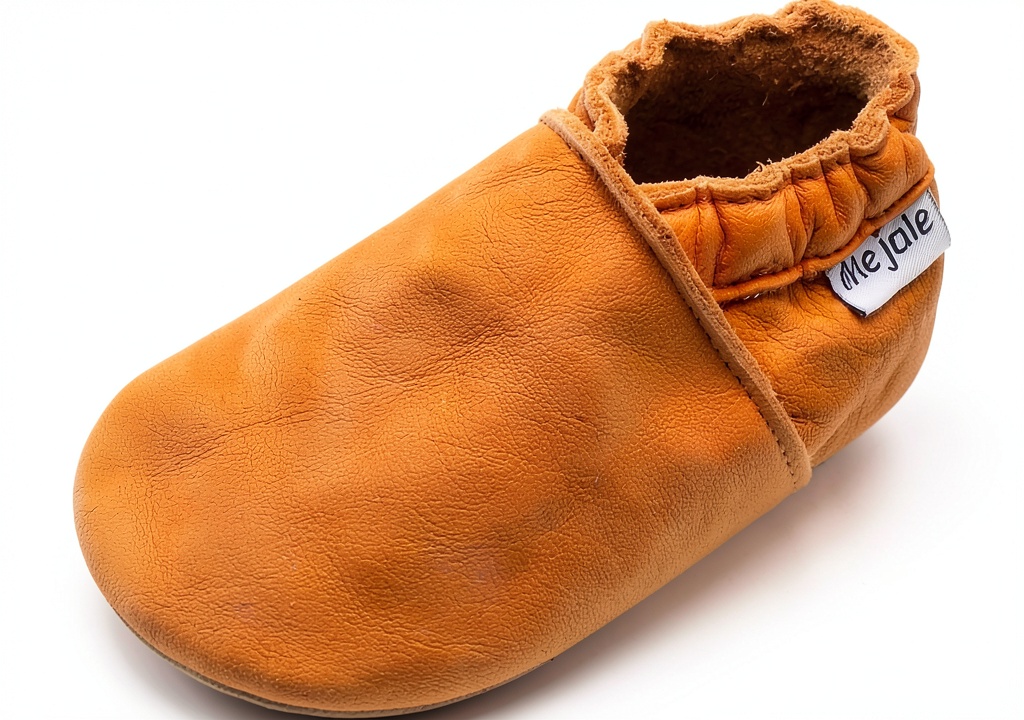 Mejale baby leather slippers in multiple colors on a soft surface